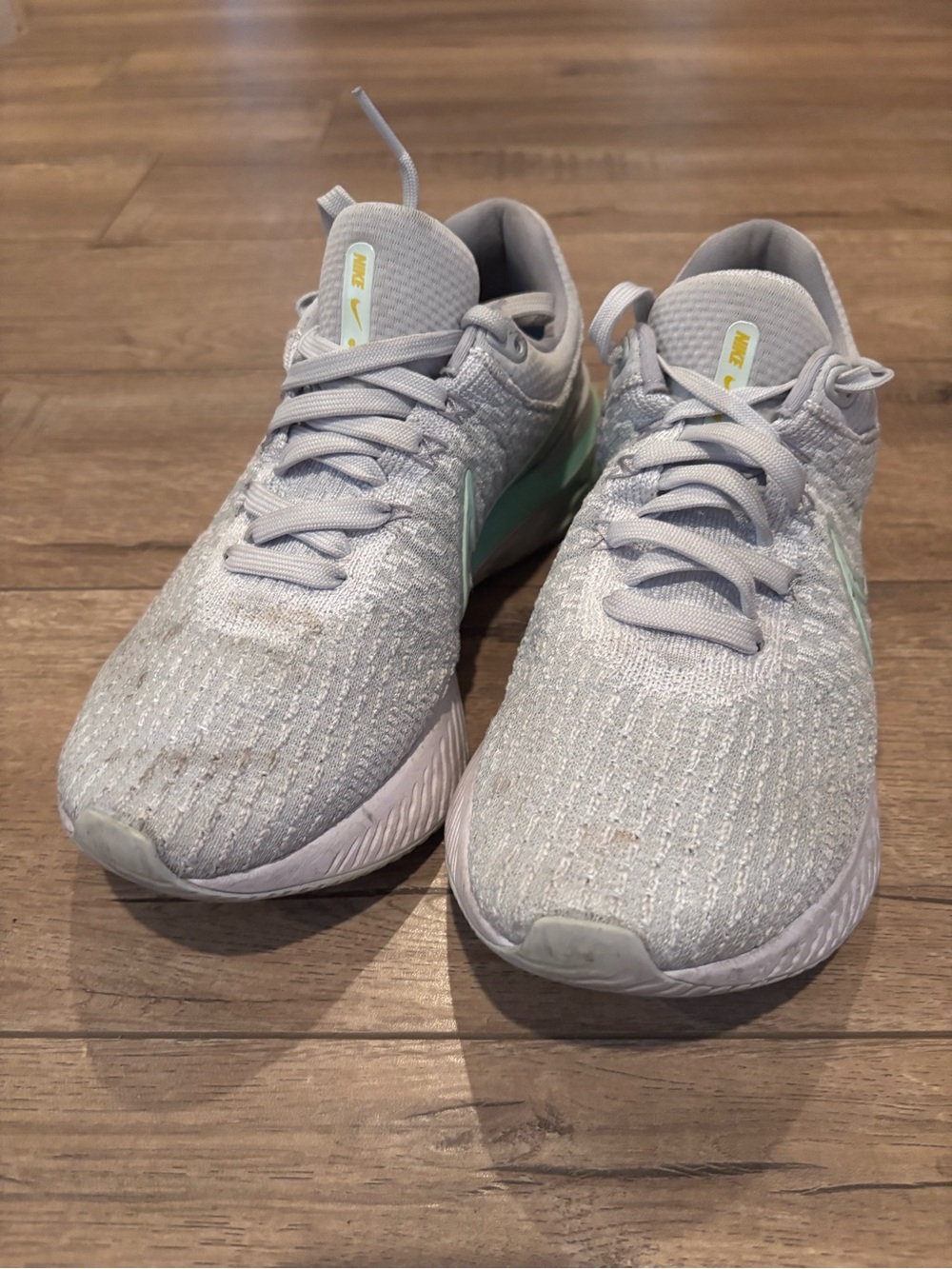Nike Women's Light Gray Sneakers with Mint Accents